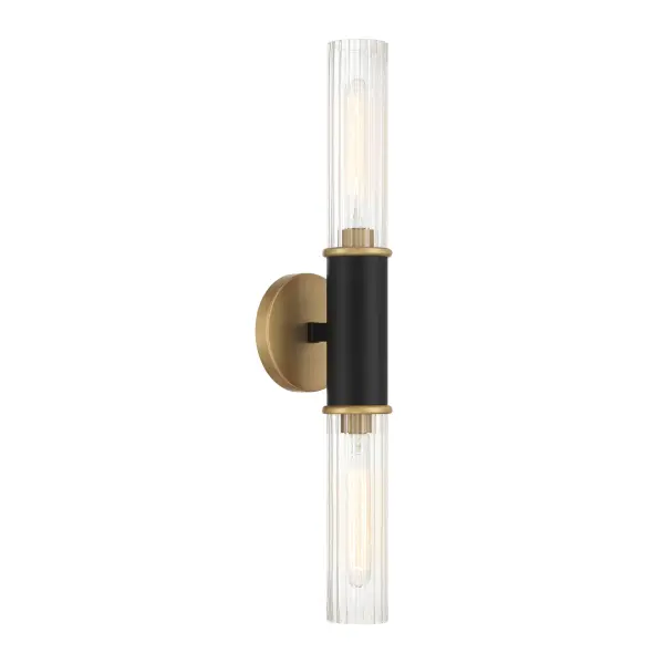 The Stamford wall sconce combines dark matte black and legacy brass finishes with clear glass shades for a sophisticated transitional look. At 24" tall, it provides substantial vertical presence perfect for flanking mirrors or creating dramatic hallway lighting.