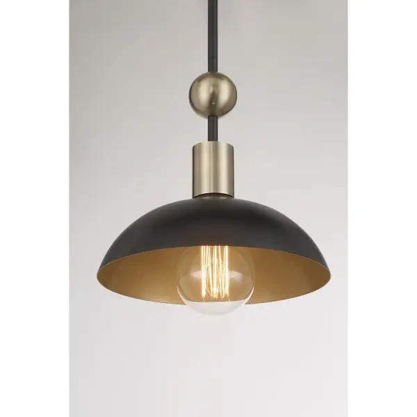 The Biloxi pendant combines coal black steel with weathered antique brass detailing for an industrial aesthetic that works in both modern and transitional spaces. At 24 inches wide, it makes a bold statement over islands and dining tables. - alternate view