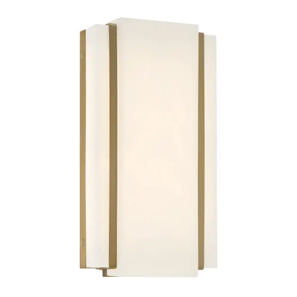 The Tanzac wall sconce combines contemporary design with practical functionality. Its soft brass finish and faux alabaster shade create warm, diffused lighting perfect for bathrooms and hallways. ADA-compliant design ensures accessibility.