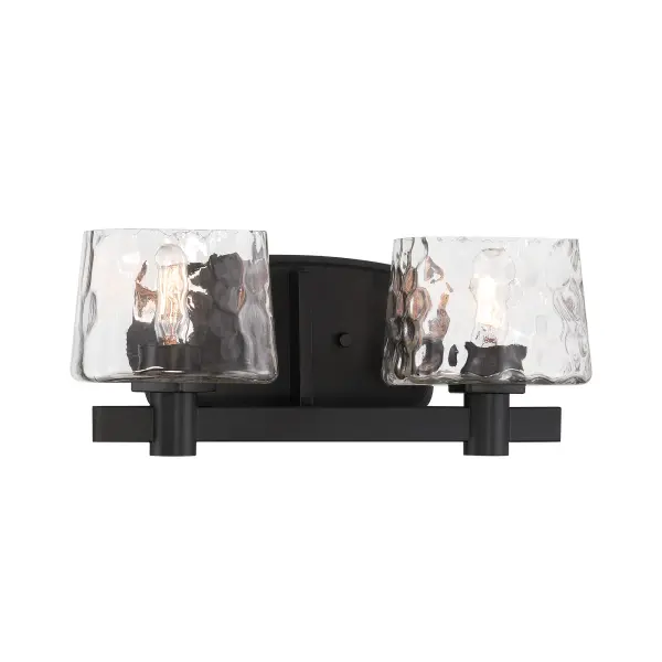 The Drysdale 2-Light Bath Vanity combines modern minimalism with industrial charm. Its coal black finish and clear hammered glass shades create visual interest while the reversible design offers installation flexibility.