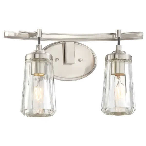 The Poleis 2-Light Bath fixture combines clean lines with traditional elegance, featuring a brushed nickel finish and clear glass shades. Perfect for smaller bathrooms and powder rooms, this compact 16-inch fixture provides excellent task lighting while maintaining a refined aesthetic.