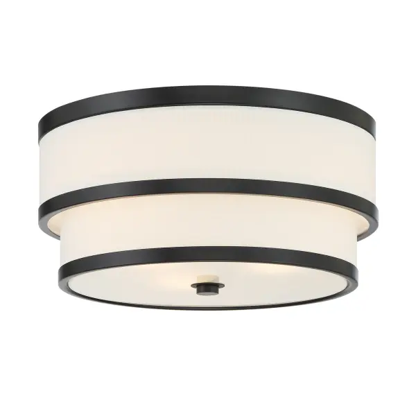 The Cascade flush mount combines contemporary coal black finish with a warm white linen shade, creating sophisticated ambient lighting perfect for low-ceiling spaces. Its compact 15-inch profile delivers style without sacrificing headroom.