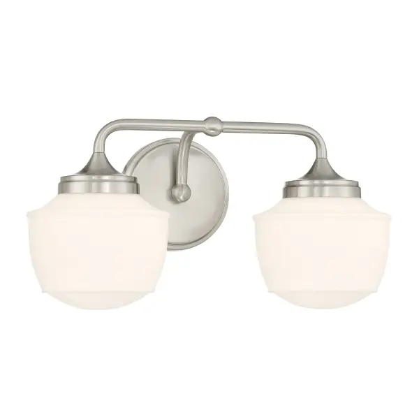 The Cornwell 2-Light Bath Vanity combines modern styling with practical functionality. Its brushed nickel finish and etched opal glass shades provide soft, even illumination perfect for grooming tasks. - alternate view