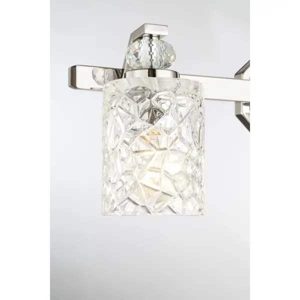 The Crystal Kay 3-Light Bath Vanity combines contemporary chrome styling with pressed glass shades for bright, even illumination. Its reversible design and 24.5-inch width make it ideal for medium-sized bathroom vanities. - alternate view