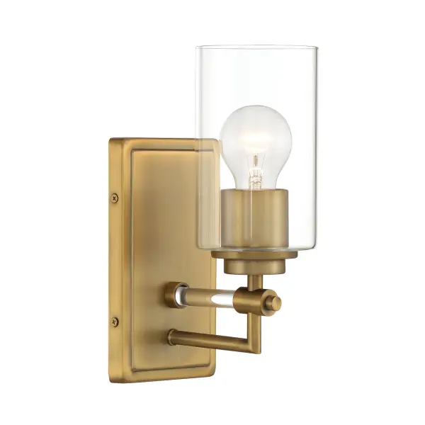 The Binsly bath vanity combines clean modern lines with the warmth of aged brass. Its compact 4.5-inch width makes it ideal for smaller bathrooms or flanking mirrors. The clear glass shade and reversible design offer versatility.