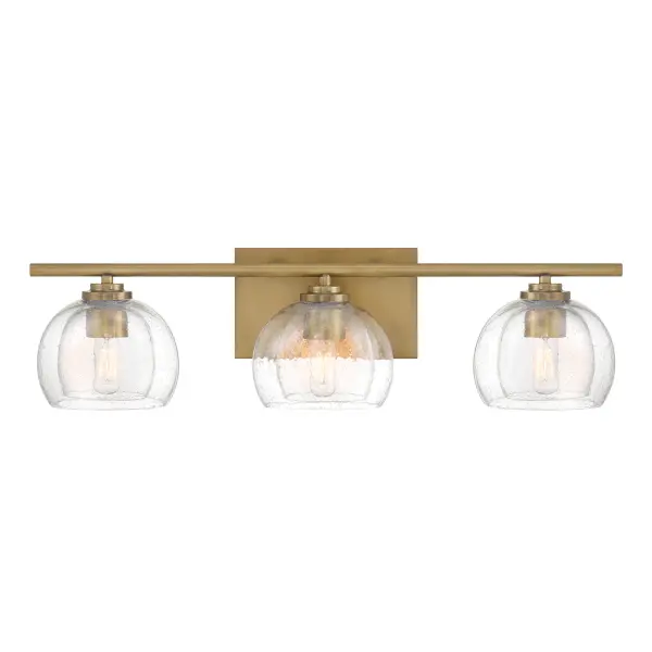 The Glint 24" vanity light combines transitional elegance with practical illumination. Legacy brass finish and clear seeded glass shades create sophisticated ambiance perfect for modern and traditional bathrooms alike.