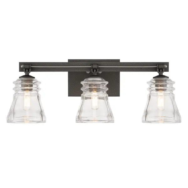 The Graham Avenue bath vanity combines traditional styling with industrial accents through its smoked iron and brushed nickel finish. Clear pressed glass shades provide excellent task lighting for bathroom vanities.