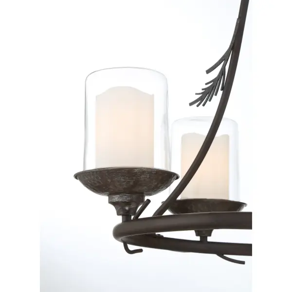 The Ponderosa Ridge brings rustic sophistication to outdoor spaces with its weathered spruce finish and silver highlights. Four lights provide ample illumination through clear glass shades, perfect for covered patios and porches. - alternate view