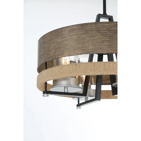 The Silver Creek pendant combines modern industrial design with coastal charm through rope accents and seedy glass. Its convertible mounting offers flexibility for various ceiling heights and outdoor spaces. - alternate view