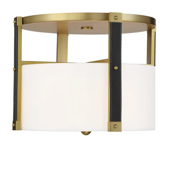 Robin Baron's Chelsea collection brings sophisticated warmth with soft brass finish, white silk shade, and distinctive leather accents. At 20" wide, it provides ample illumination while maintaining an elegant low profile.