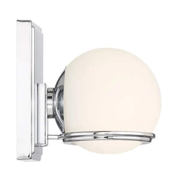 The Hollywood Nights sconce delivers professional-grade lighting with 714 lumens and exceptional 93 CRI for accurate color rendering. Its compact chrome design and etched opal glass create soft, flattering illumination perfect for vanity applications. - alternate view