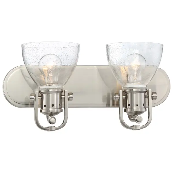 The Bath Art 2-Light vanity fixture combines brushed nickel finish with clear seeded glass shades for timeless bathroom elegance. Compact 16-inch width fits most vanity spaces while providing ample illumination.