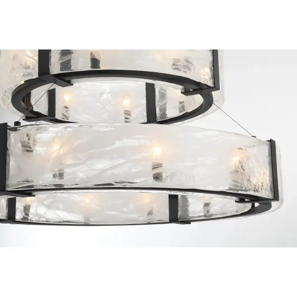 The Cloud Break pendant makes a bold architectural statement with 20 candelabra bulbs arranged in a modern composition. Cloud glass diffusers soften the light while the coal black finish adds contemporary sophistication to large spaces. - alternate view