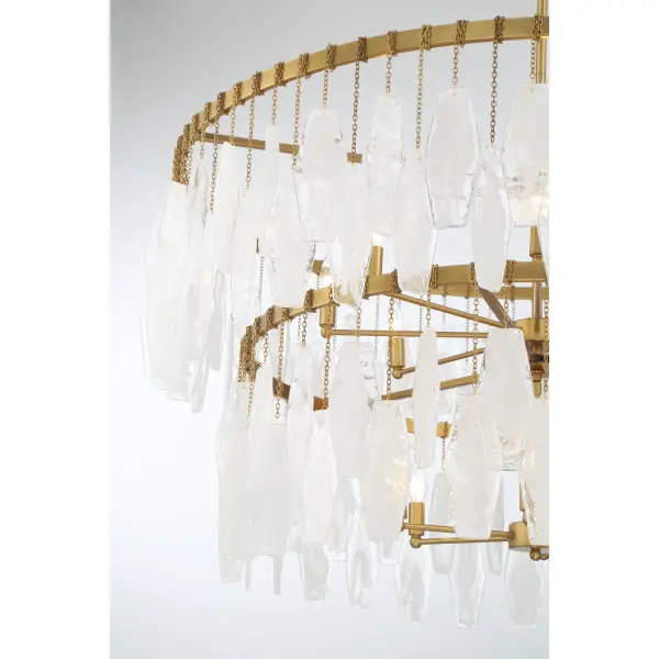 The Willow pendant makes a dramatic statement with 14 candelabra lights arranged across a 45-inch span. Legacy brass finish paired with white swirl glass shades creates timeless elegance perfect for large dining rooms and grand entryways. - alternate view