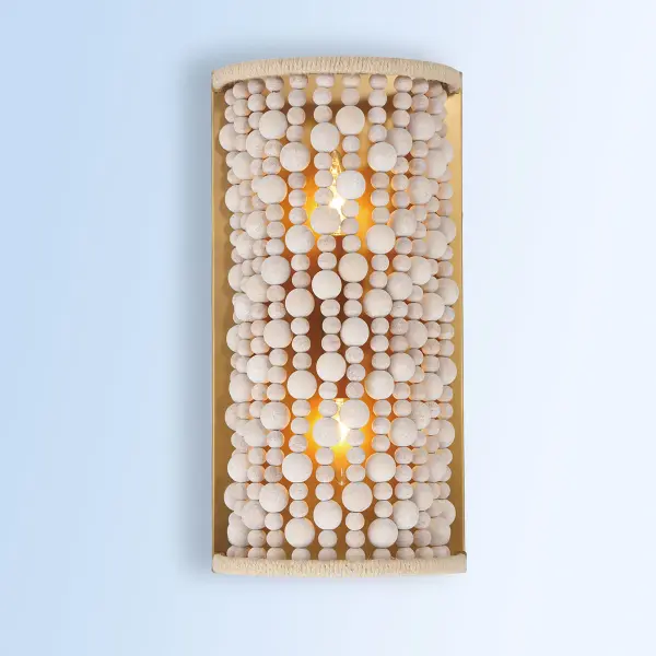 The Horsmore wall sconce brings organic warmth to any space with its distinctive bleached wooden beads and hemp rope accents. The painted legacy brass finish adds subtle sophistication while the natural materials create a relaxed, coastal aesthetic. - alternate view