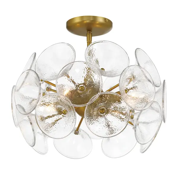 The Winter semi-flush mount combines soft brass finish with textured clear fluted glass for sophisticated ambient lighting. Its 16-inch width and 4-light configuration provide ample illumination for smaller spaces.