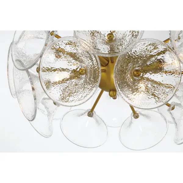 The Winter semi-flush mount combines soft brass finish with textured clear fluted glass for sophisticated ambient lighting. Its 16-inch width and 4-light configuration provide ample illumination for smaller spaces. - alternate view