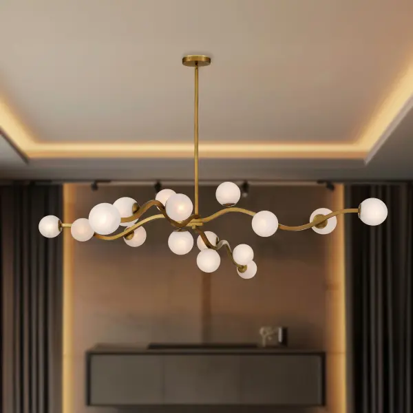 The Curven 75" chandelier makes a dramatic impact with 16 lights spanning over 6 feet. Its Legacy Brass finish and etched alabaster glass create warm, diffused illumination perfect for large dining rooms and commercial spaces. - alternate view