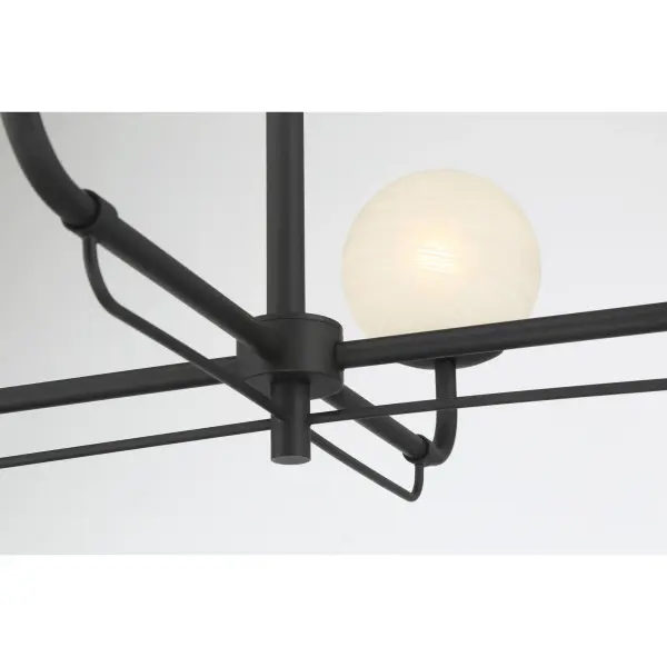 The Whitehall 30" chandelier combines classic elegance with modern simplicity. Its dark matte black finish and etched alabaster glass shades create soft, diffused lighting perfect for dining and living spaces. - alternate view
