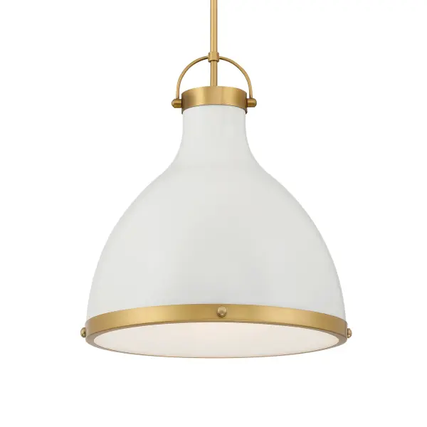 The Lynk pendant combines soft off-white cream glass with legacy brass hardware for a refined transitional look. At 16.5" wide, it's perfectly scaled for intimate dining spaces, kitchen islands, or bedroom lighting.