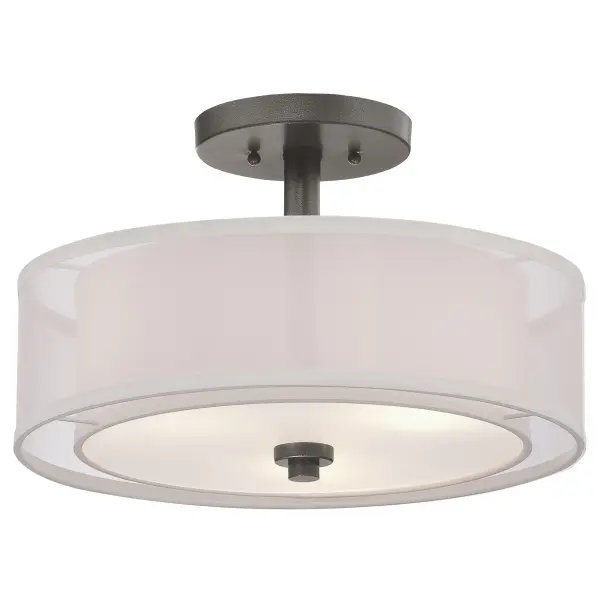 The Parsons Studio semi-flush combines industrial smoked iron with sophisticated layered linen shades for soft, diffused lighting. Its compact 15-inch profile fits smaller spaces while the three-bulb design provides ample illumination.