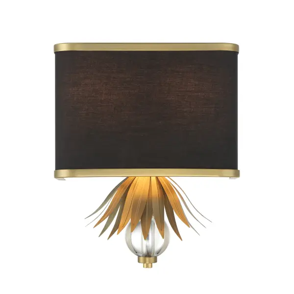 The Caprio wall sconce combines warm brushed brass with a refined fabric shade and crystal details, creating sophisticated ambient lighting. Its compact 11-inch width makes it ideal for flanking mirrors or beds. - alternate view