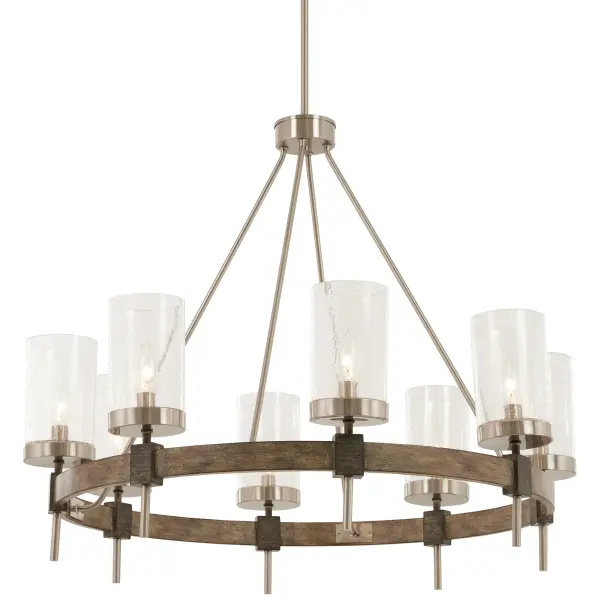 The Bridlewood 8-Light Chandelier combines transitional sophistication with farmhouse warmth. Its two-tone Stone Grey and Brushed Nickel finish paired with clear seeded glass creates visual interest while maintaining versatility across design styles.