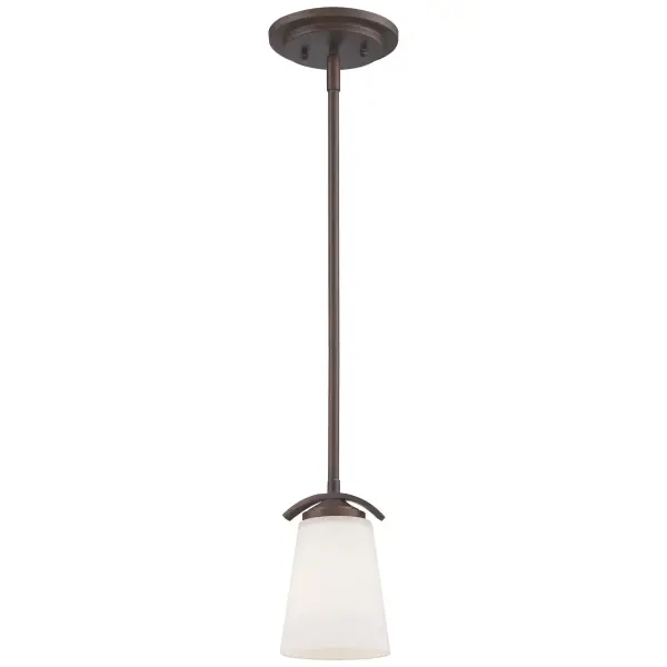 The Overland Park mini pendant combines vintage bronze finish with etched white glass for a timeless look. Its compact 4.75-inch diameter makes it ideal for smaller spaces or clustered installations over islands.