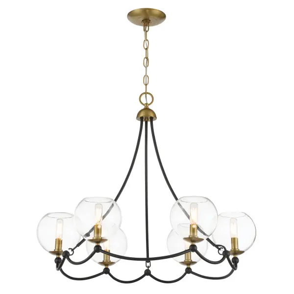 The Kearney Park chandelier combines coal black steel with soft brass accents and clear glass shades for a sophisticated modern industrial aesthetic. Its 6-light configuration and 29-inch width make it versatile for dining rooms and kitchen islands.