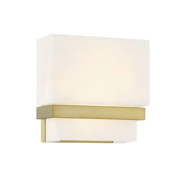 The Arzon LED Wall Sconce combines contemporary styling with practical functionality. Its soft brass finish and faux alabaster shade create warm, diffused lighting perfect for intimate spaces. ADA-compliant design and high CRI make it ideal for bathrooms and hallways.
