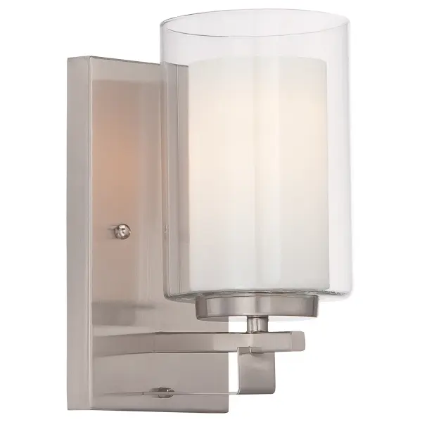 The Parsons Studio bath sconce combines timeless design with modern functionality. Its brushed nickel finish and dual glass shades provide both ambient and task lighting, making it ideal for bathroom vanities and powder rooms.