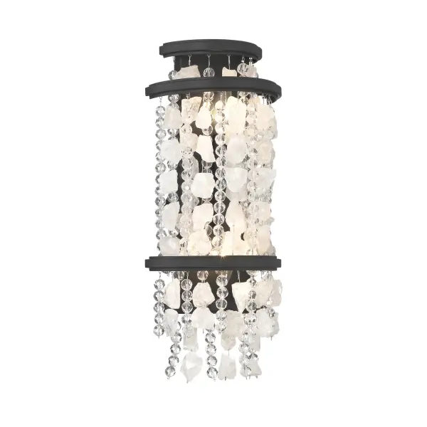 The Shimmering Elegance wall sconce combines contemporary styling with luxurious crystal detailing. Its sand coal black finish provides dramatic contrast to the quartz crystalline and cut glass beads, creating elegant light diffusion.
