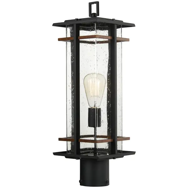 The San Marcos post mount combines traditional outdoor lighting with transitional style. Black aluminum construction with antique copper accents and clear seeded glass creates warm, welcoming illumination for pathways and entries.