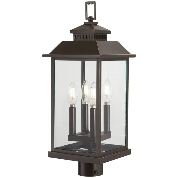 The Miner's Loft post mount brings industrial elegance to outdoor spaces with its oil rubbed bronze finish accented by gold highlights. Four candelabra bulbs behind clear glass panels create warm, inviting illumination.