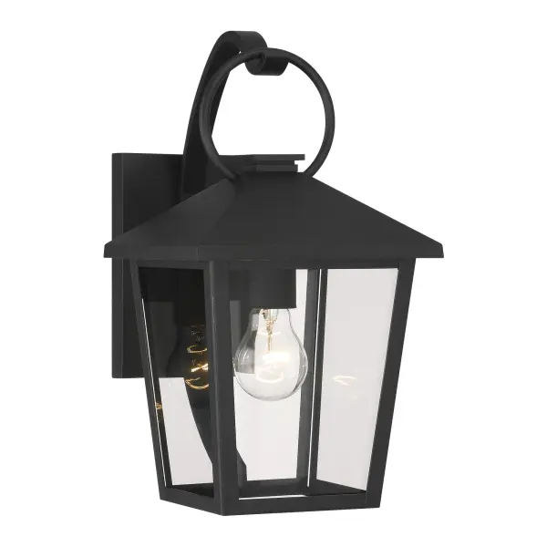 The Parkside wall sconce combines durability with timeless design. Its sand coal black aluminum frame and clear glass shade deliver reliable outdoor illumination while complementing various architectural styles.