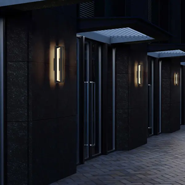 The In & Out Wall Sconce combines modern geometric design with versatile wet-location performance. Its intersecting rectangular forms create striking visual interest while delivering reliable ambient lighting for both residential and commercial applications. - alternate view
