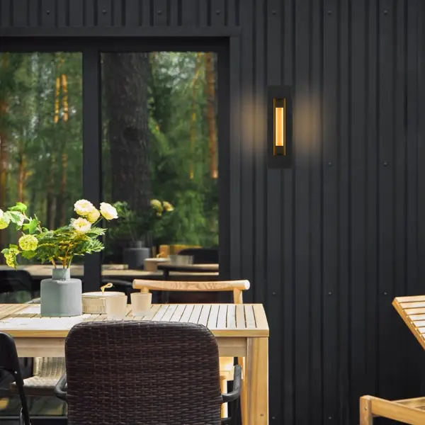 The Layer Wall Sconce creates dramatic visual interest through overlapping illuminated panels that cast beautiful light and shadow patterns. The interior brass panel adds warmth, while wet location rating and 3-CCT customizable lighting make it versatile for any setting. - alternate view