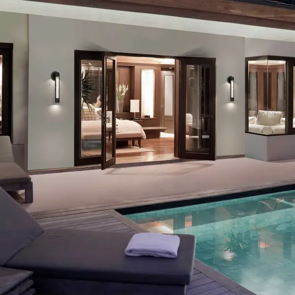 The Tig 18" Wall Sconce features pressed water-patterned glass that casts a beautiful mottled light effect, creating warmth and visual interest. With 3-CCT adjustable lighting, dimming, and wet location rating, it's perfect for outdoor spaces. - alternate view