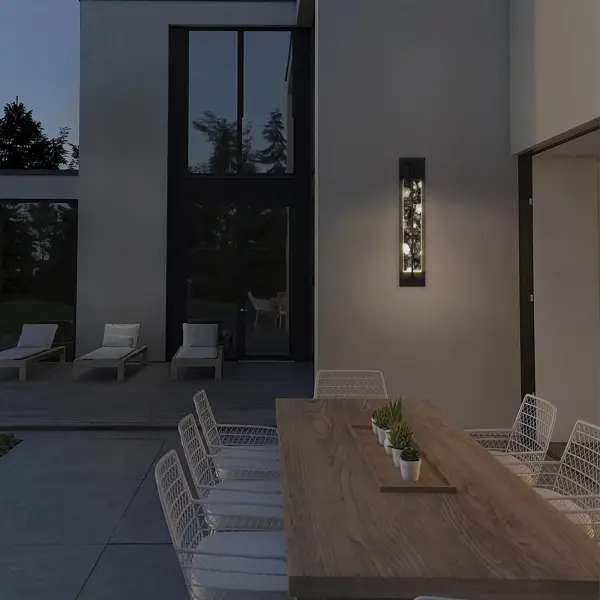 The Rivera 32" Wall Sconce combines cloudy crystal with a minimalist black frame for timeless sophistication. Wet-rated for outdoor use with customizable 3-CCT lighting and dimming, it adds depth and warmth to any space. - alternate view