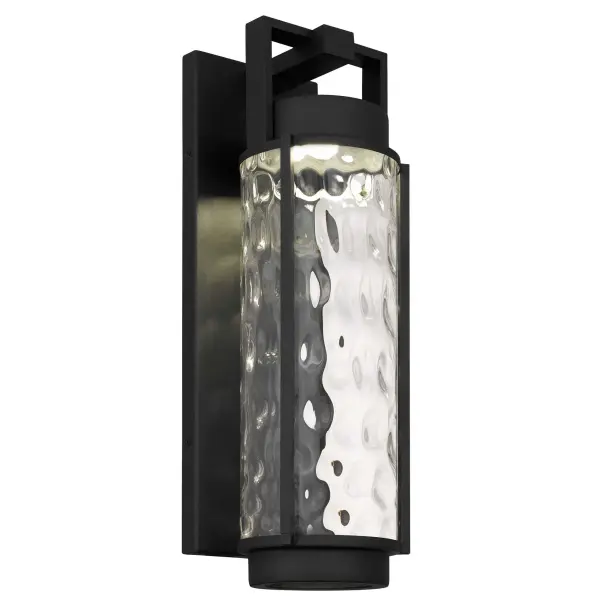 The Winston outdoor wall sconce combines timeless lantern design with contemporary LED efficiency. Featuring exquisite mouth-blown clear hammered glass and customizable 3-CCT color temperature control, it's wet-rated for durability.