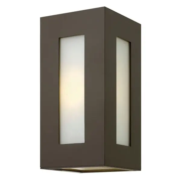 Dorian’s robust design in durable aluminum construction is offered in a Bronze finish. This contemporary fixture allows light to emit from white glass windows.