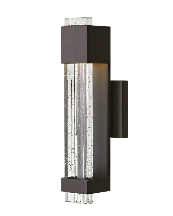 Glacier’s impressive form merges industrial and contemporary design elements into a breathtaking silhouette. A substantial block of clear seedy glass with etched grooves brilliantly channels light from the high-performance LED, which is held in suspension by the powder-coated aluminum frame.