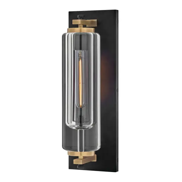 Solid and robust, Lourde’s name says it all. Heavy, layered glass cast in soft cylindrical shapes creates captivating reflections and refractions to illuminate any outdoor or indoor space with a warm glow. The modern, industrial details paired with the Black and Heritage Brass finishes make a bold statement among any aesthetic.