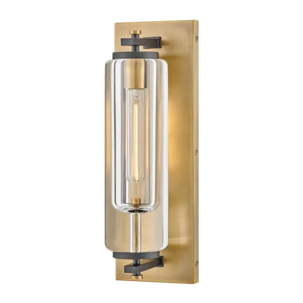 Solid and robust, Lourde’s name says it all. Heavy, layered glass cast in soft cylindrical shapes creates captivating reflections and refractions to illuminate any outdoor or indoor space with a warm glow. The modern, industrial details paired with the Black and Heritage Brass finishes make a bold statement among any aesthetic.