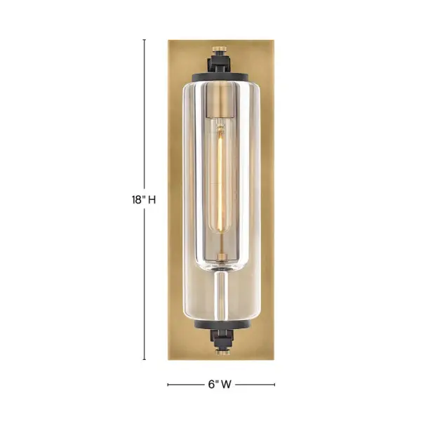Solid and robust, Lourde’s name says it all. Heavy, layered glass cast in soft cylindrical shapes creates captivating reflections and refractions to illuminate any outdoor or indoor space with a warm glow. The modern, industrial details paired with the Black and Heritage Brass finishes make a bold statement among any aesthetic. - alternate view