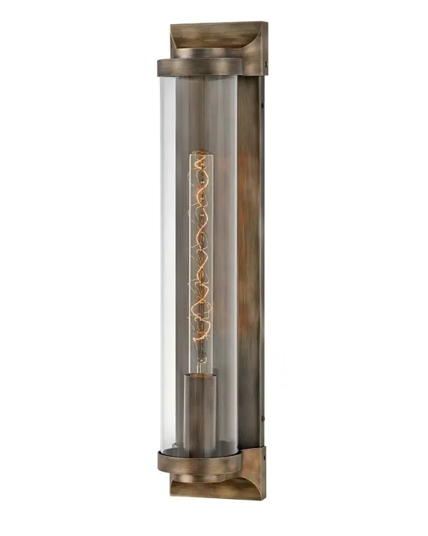 Take the indoor style of statement sconces outside. Drawing inspiration from the bygone era, Pearson emanates a feeling of nostalgia right outside your door. Featuring cast symmetrical end caps and clear cylindrical glass, Pearson combines the vintage look with a sleek backplate for the most sophisticated illumination in your outdoor living area. Available in a Burnished Bronze or Textured Black finish.