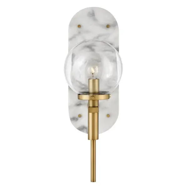 An alluring profile that blends a vintage and modern aesthetic, Gilda is the best of both worlds. This show-stopping sconce showcases a large clear glass globe atop a brass stem with contrasting rivets on a luxurious Black Marble or Faux Alabaster backplate. Gilda features a concealed on/off switch and removable cord and can be hardwired or plugged in. - alternate view