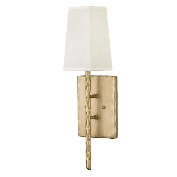Tress approaches style from a different angle. The off-white textured fabric shade is bias-cut and framed in overlapping, hammered metal rods of Champagne Gold or Forged Iron. This simple structure translates into a sophisticated trapezoidal prism. Tress uses this natural look to add an organic feel to transitional decor.