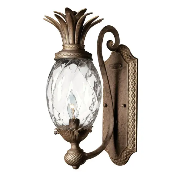 A Hinkley classic, the ornate Plantation collection features exceptional pineapple shaped, clear optic glass that makes a noble statement. The elaborate, decorative cast detailing is accentuated by its lush finish.