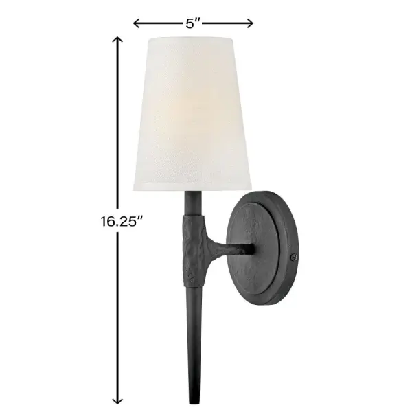 Sleek candle arms topped by softly tapered fabric shades perfectly complement Beaumont's sturdy hand-hammered details. Rustic yet traditional, the stylish transitional silhouette works well in any setting, from classically elegant to chic and modern. - alternate view
